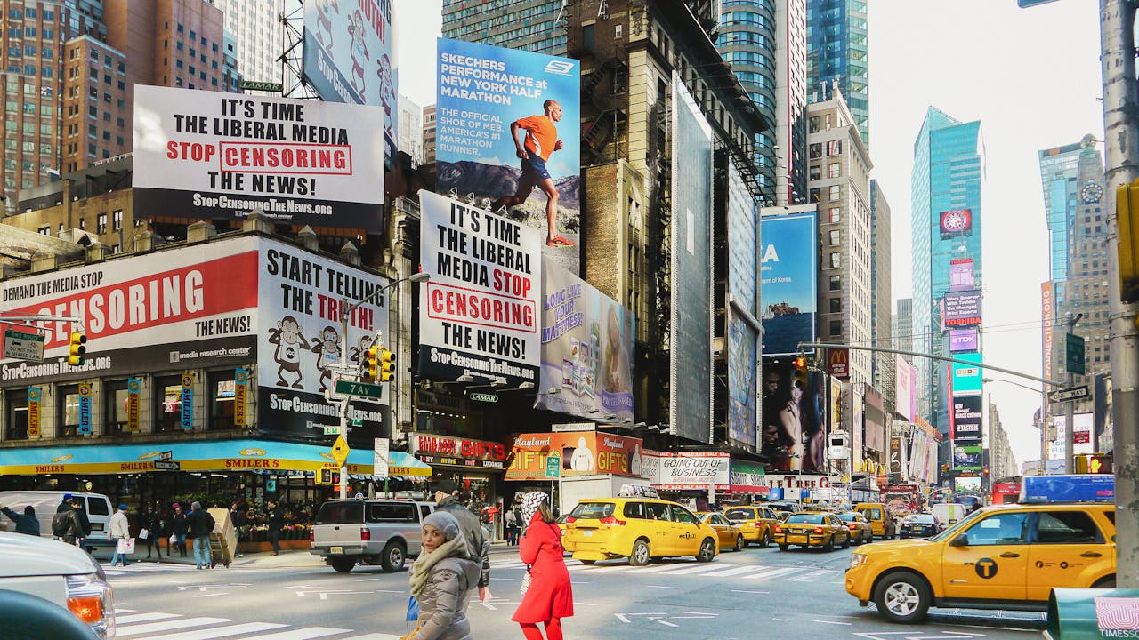 Times Square bustling with taxis and striking billboards. A vibrant downtown scene in New York City.